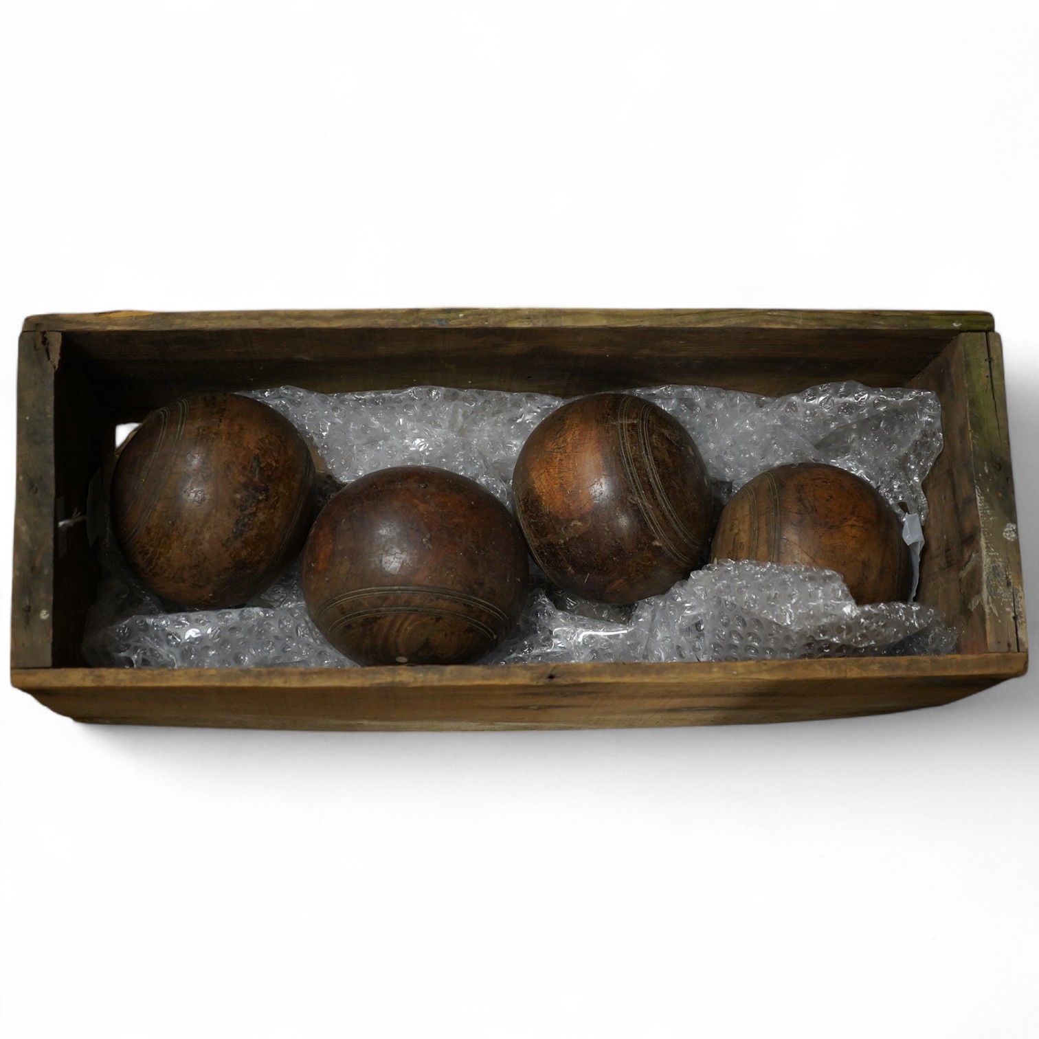 A set of four lignum vitae bowls